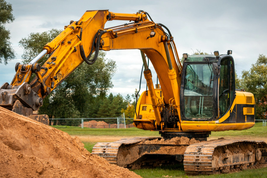 excavator hauling dirt in residential area 1